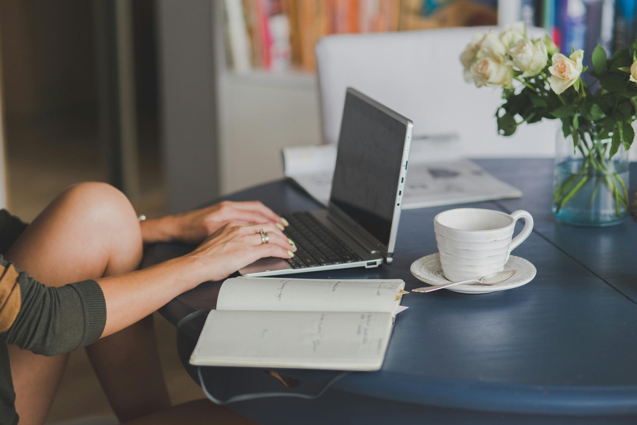 Woman working wtih laptop and coffee